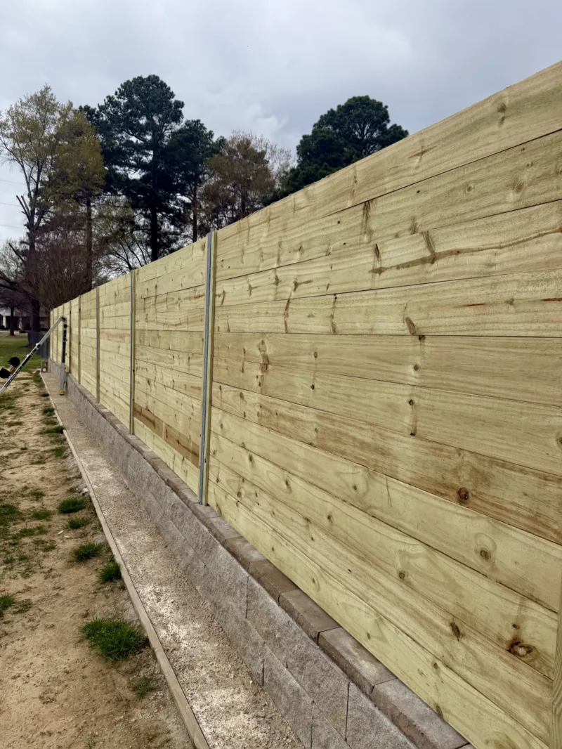 Fence on a concrete curb